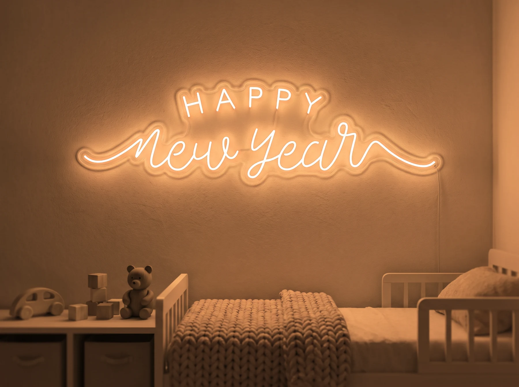 Neonskylt «Happy New Year» i orange LED-neon, monterad på vägg