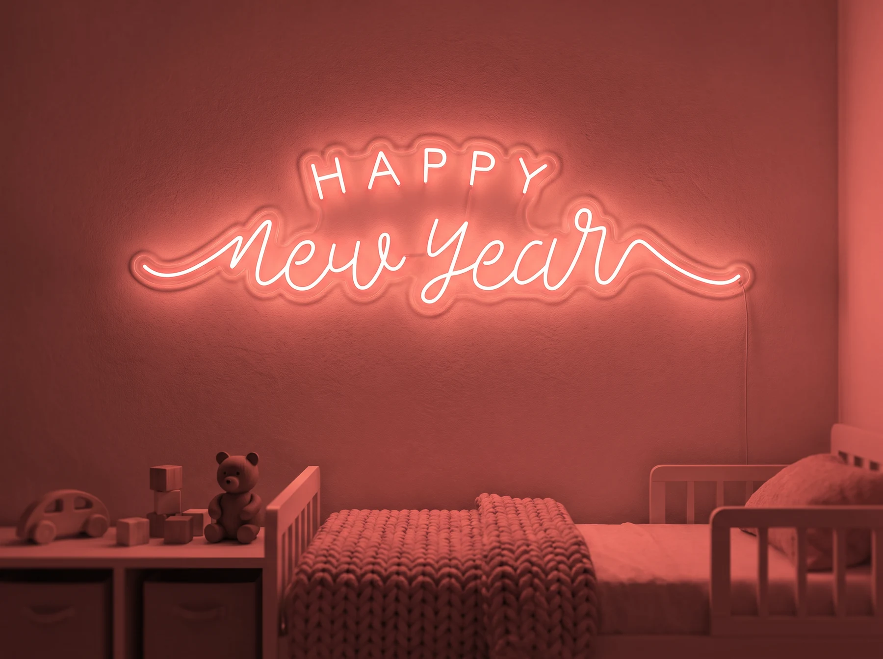 Neonskylt «Happy New Year» i röd LED-neon, monterad på vägg