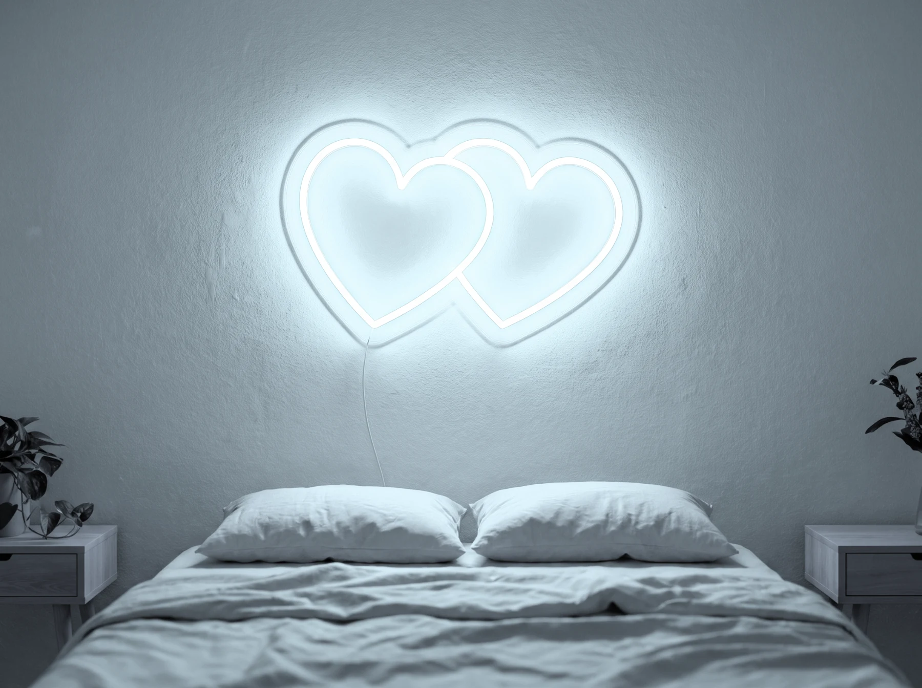 Neonskylt «Hjärtan» i iskall vit LED-neon, monterad på vägg