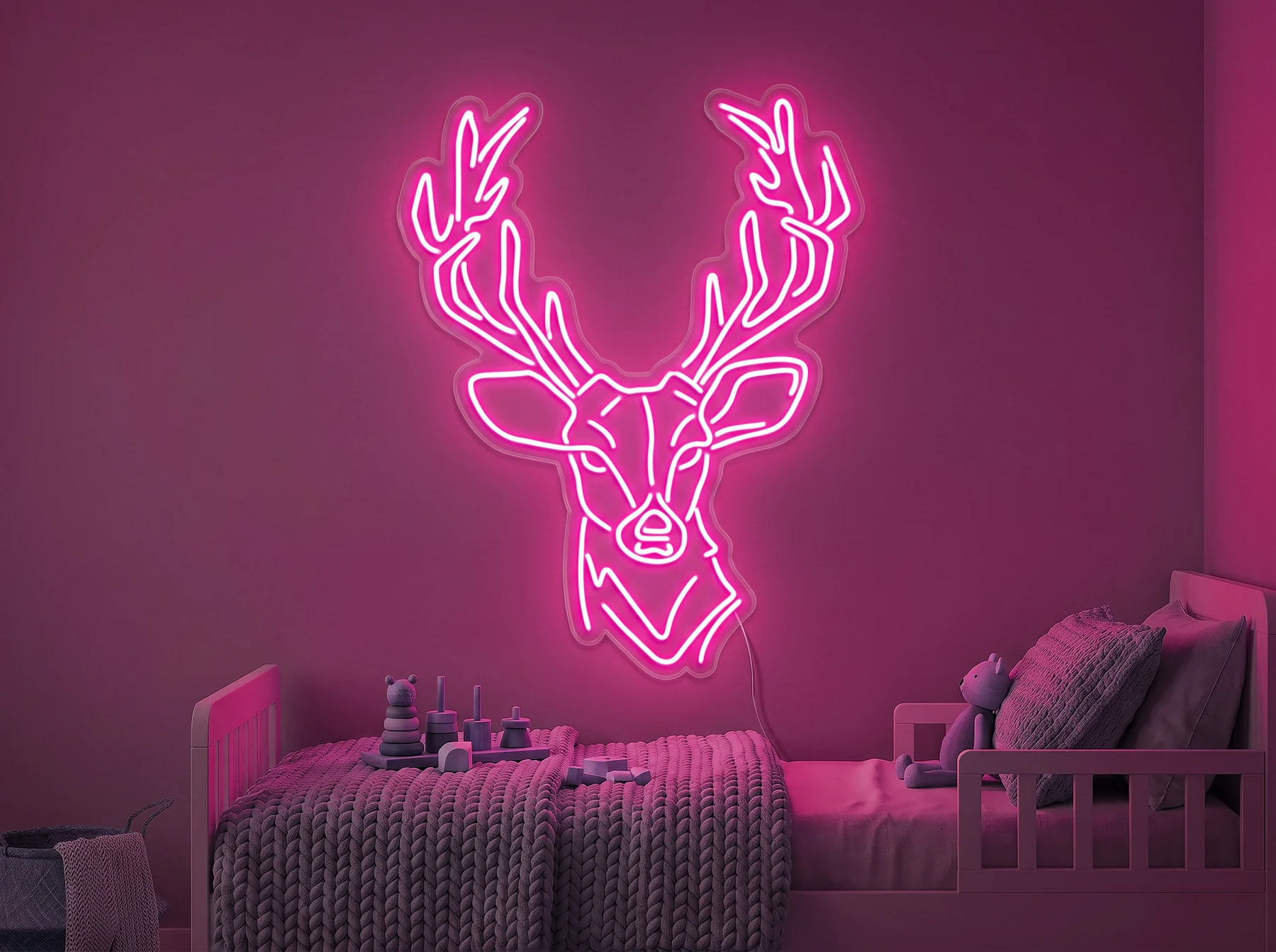 Neonskylt «Hjort» i rosa LED-neon, monterad på vägg