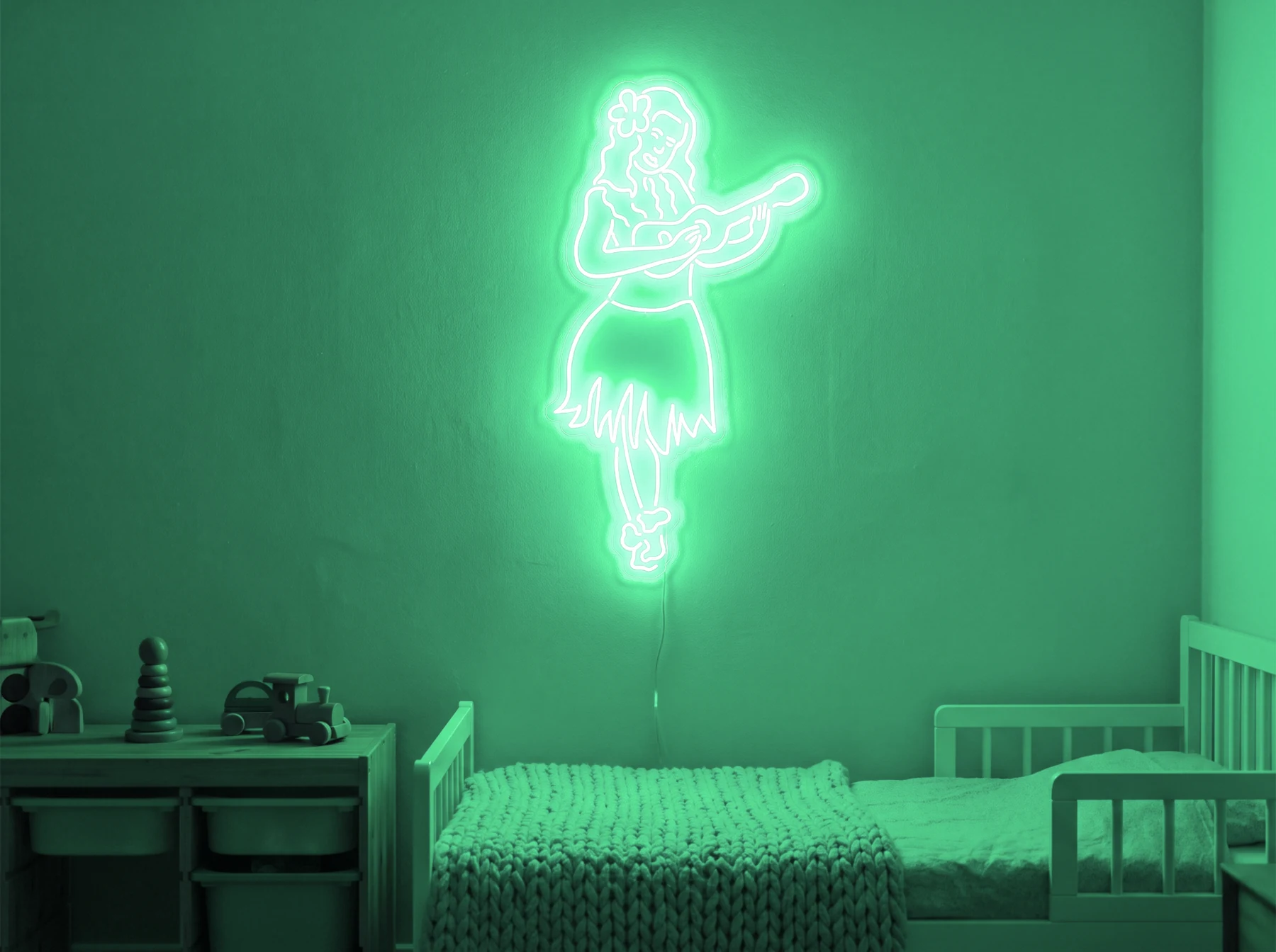 Neonskylt «Huladansös» i mintgrön LED-neon, monterad på vägg