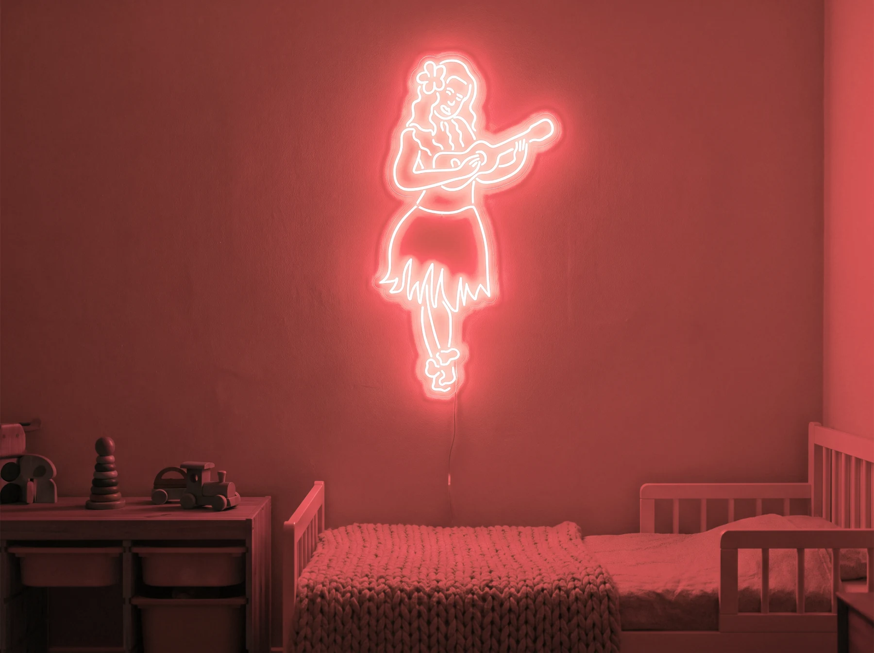 Neonskylt «Huladansös» i röd LED-neon, monterad på vägg