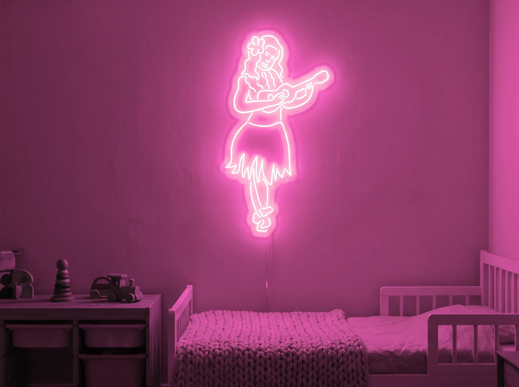 Neonskylt «Huladansös» i rosa LED-neon, monterad på vägg