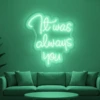 Neonskylt «It Was Always You» i mintgrön LED-neon, monterad på vägg