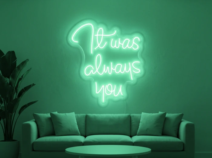 Neonskylt «It Was Always You» i mintgrön LED-neon, monterad på vägg