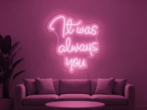 Neonskylt «It Was Always You» i rosa LED-neon, monterad på vägg