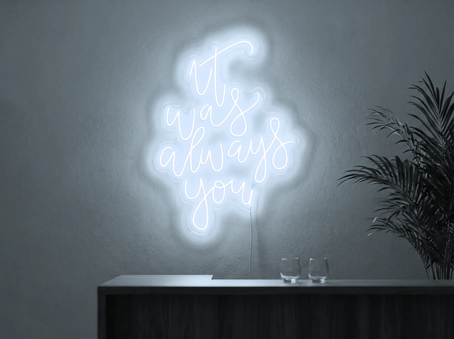 Neonskylt «It Was Always You, smal» i iskall vit LED-neon, monterad på vägg