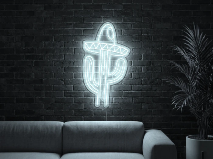 Neonskylt «Kaktus med hatt» i iskall vit LED-neon, monterad på vägg