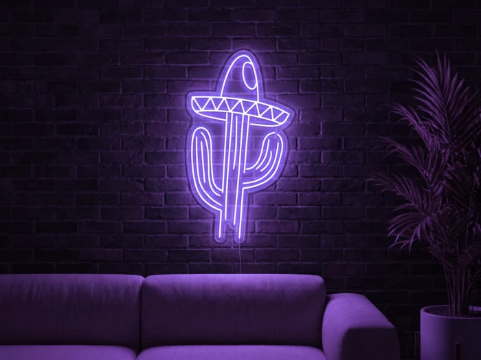Neonskylt «Kaktus med hatt» i lila LED-neon, monterad på vägg