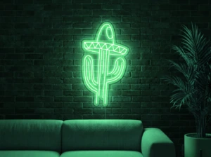 Neonskylt «Kaktus med hatt» i mintgrön LED-neon, monterad på vägg
