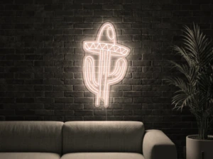 Neonskylt «Kaktus med hatt» i varmvit LED-neon, monterad på vägg
