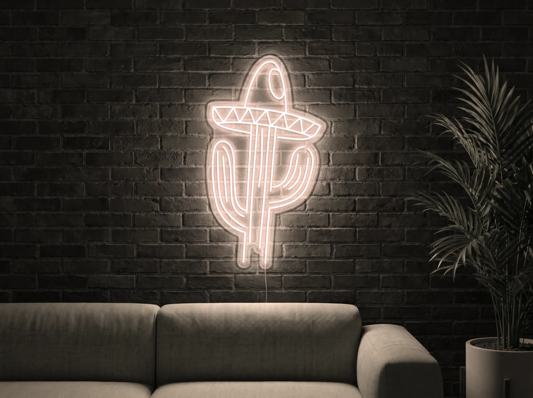 Neonskylt «Kaktus med hatt» i varmvit LED-neon, monterad på vägg