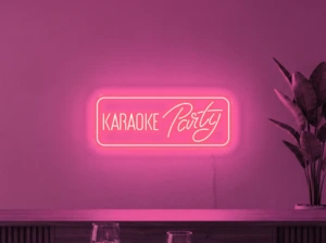 Neonskylt «Karaoke Party» i rosa LED-neon, monterad på vägg