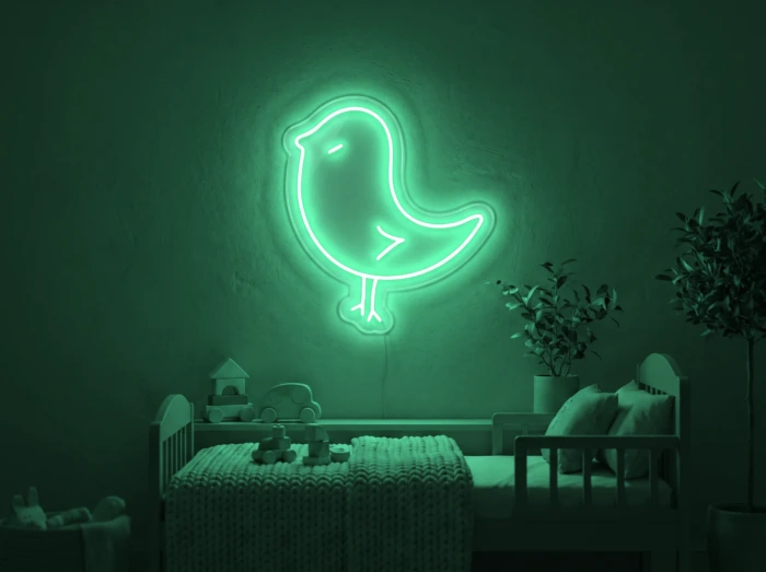 Neonskylt «Kyckling» i mintgrön LED-neon, monterad på vägg