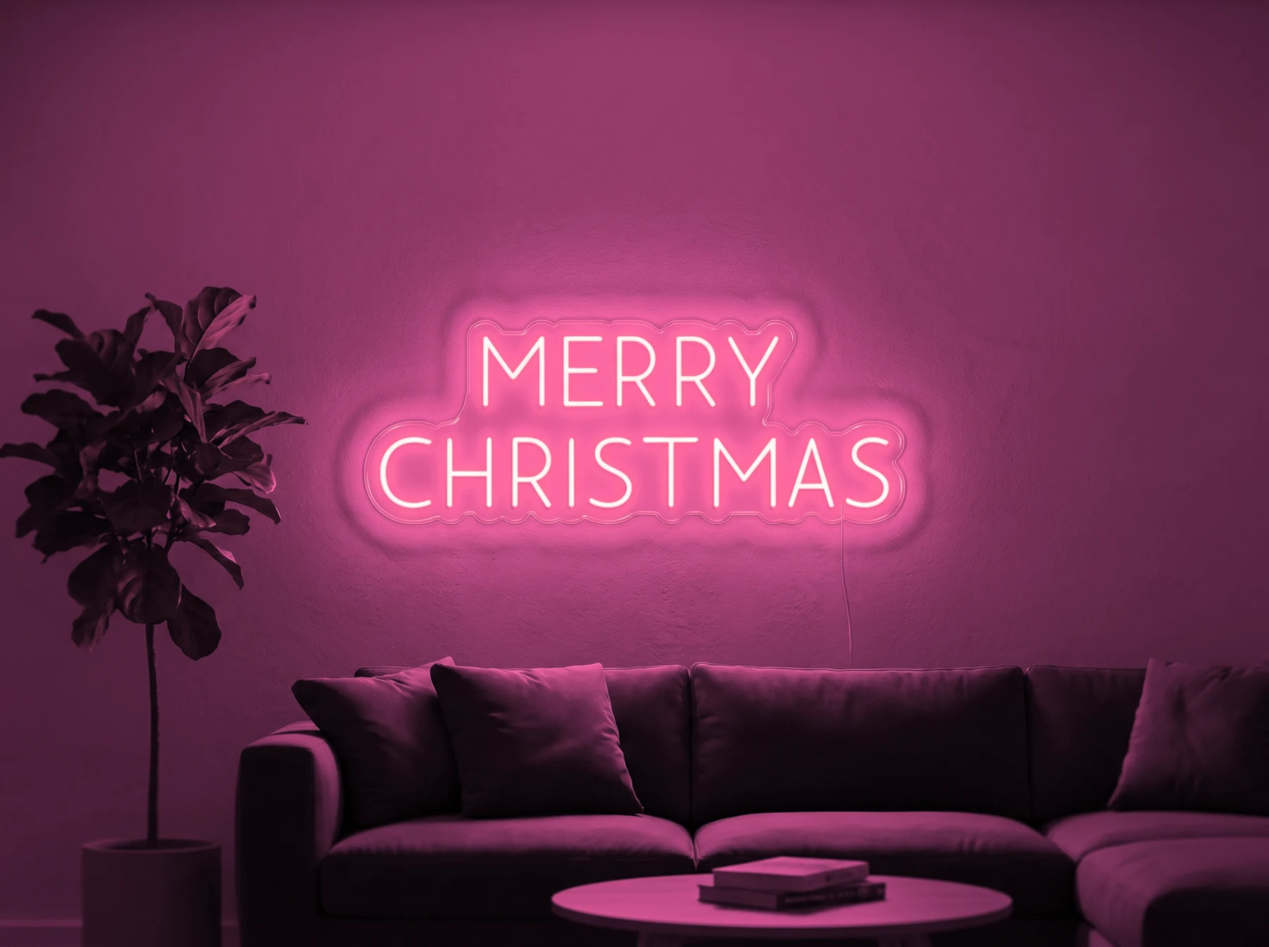 Neonskylt «Merry Christmas, versaler» i rosa LED-neon, monterad på vägg