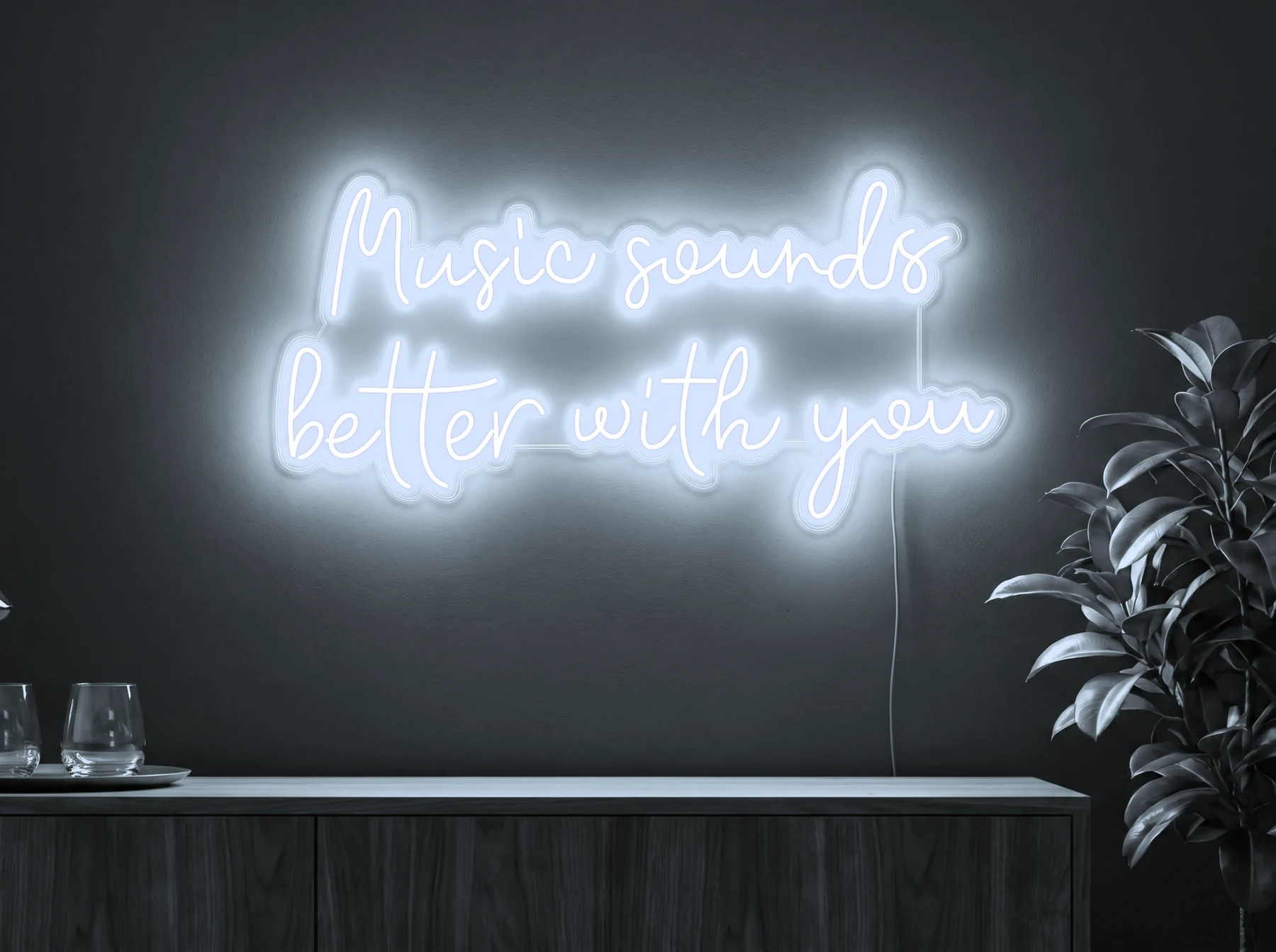 Neonskylt «Music Sounds Better With You» i iskall vit LED-neon, monterad på vägg