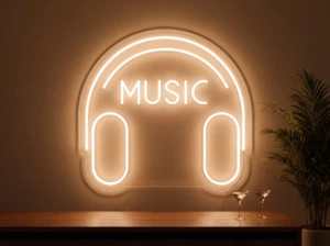 Neonskylt «Musik» i orange LED-neon, monterad på vägg