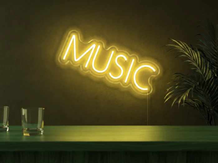 Neonskylt «Musik, smal» i gul LED-neon, monterad på vägg