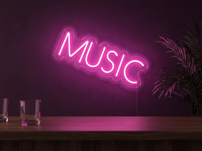 Neonskylt «Musik, smal» i rosa LED-neon, monterad på vägg