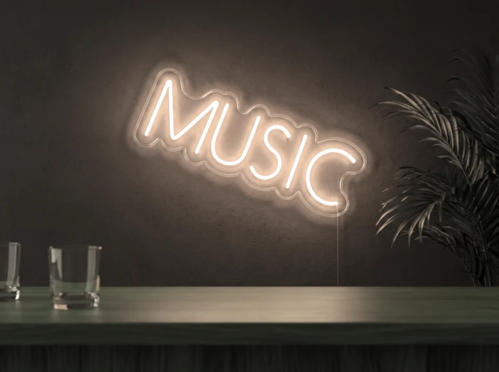 Neonskylt «Musik, smal» i varmvit LED-neon, monterad på vägg