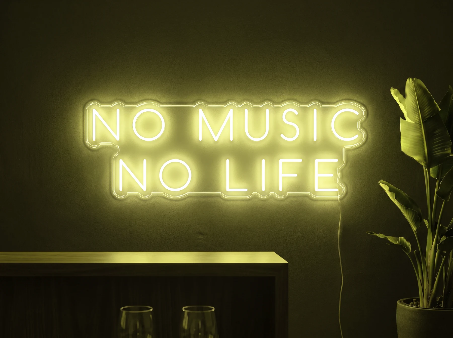 Neonskylt «No Music No Life» i gul LED-neon, monterad på vägg
