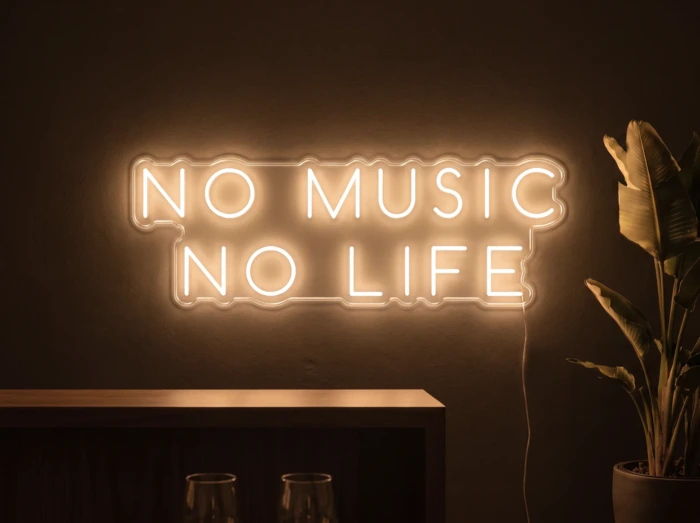 Neonskylt «No Music No Life» i orange LED-neon, monterad på vägg