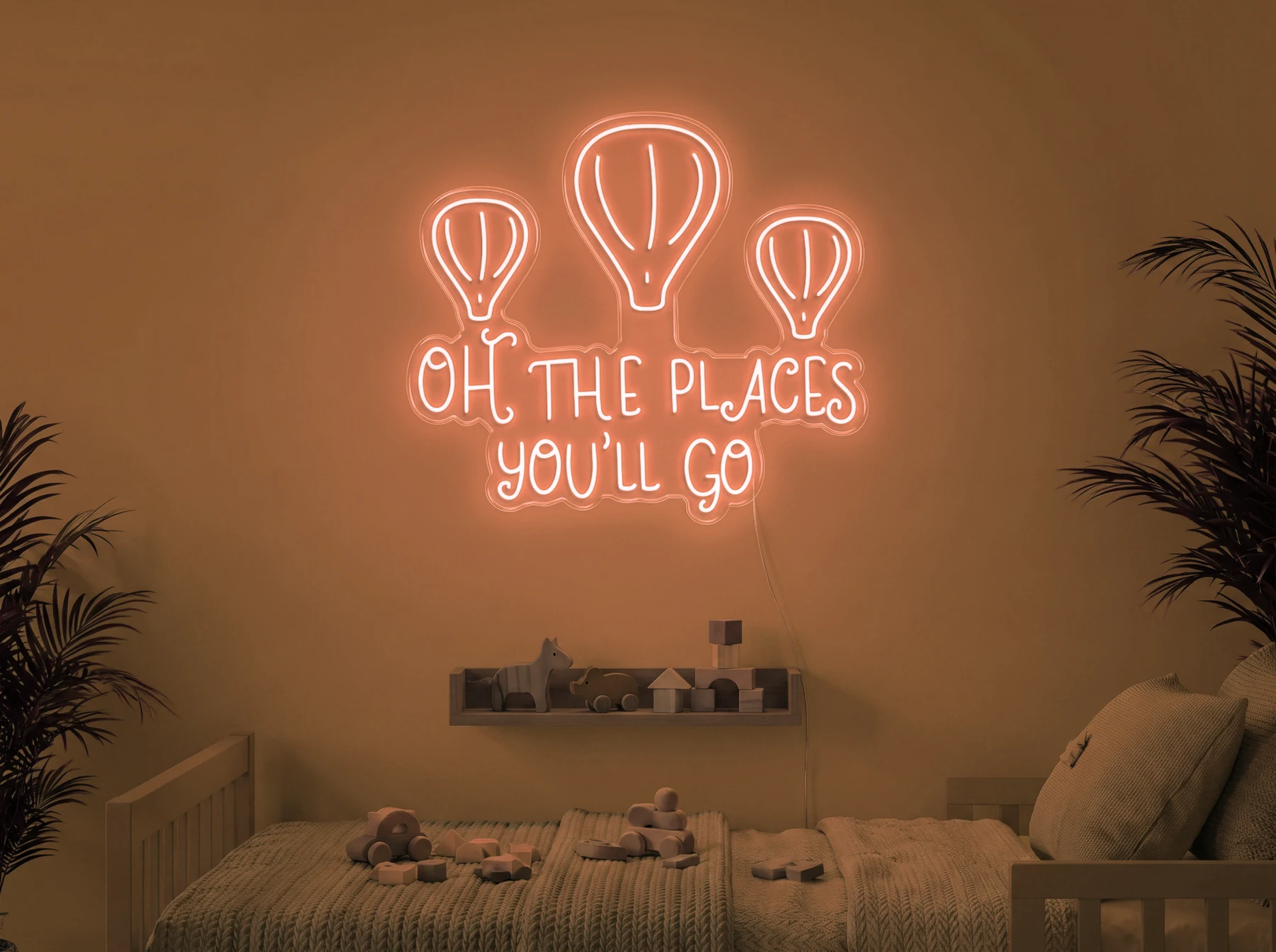 Neonskylt «Oh The Places You’ll Go» i orange LED-neon, monterad på vägg