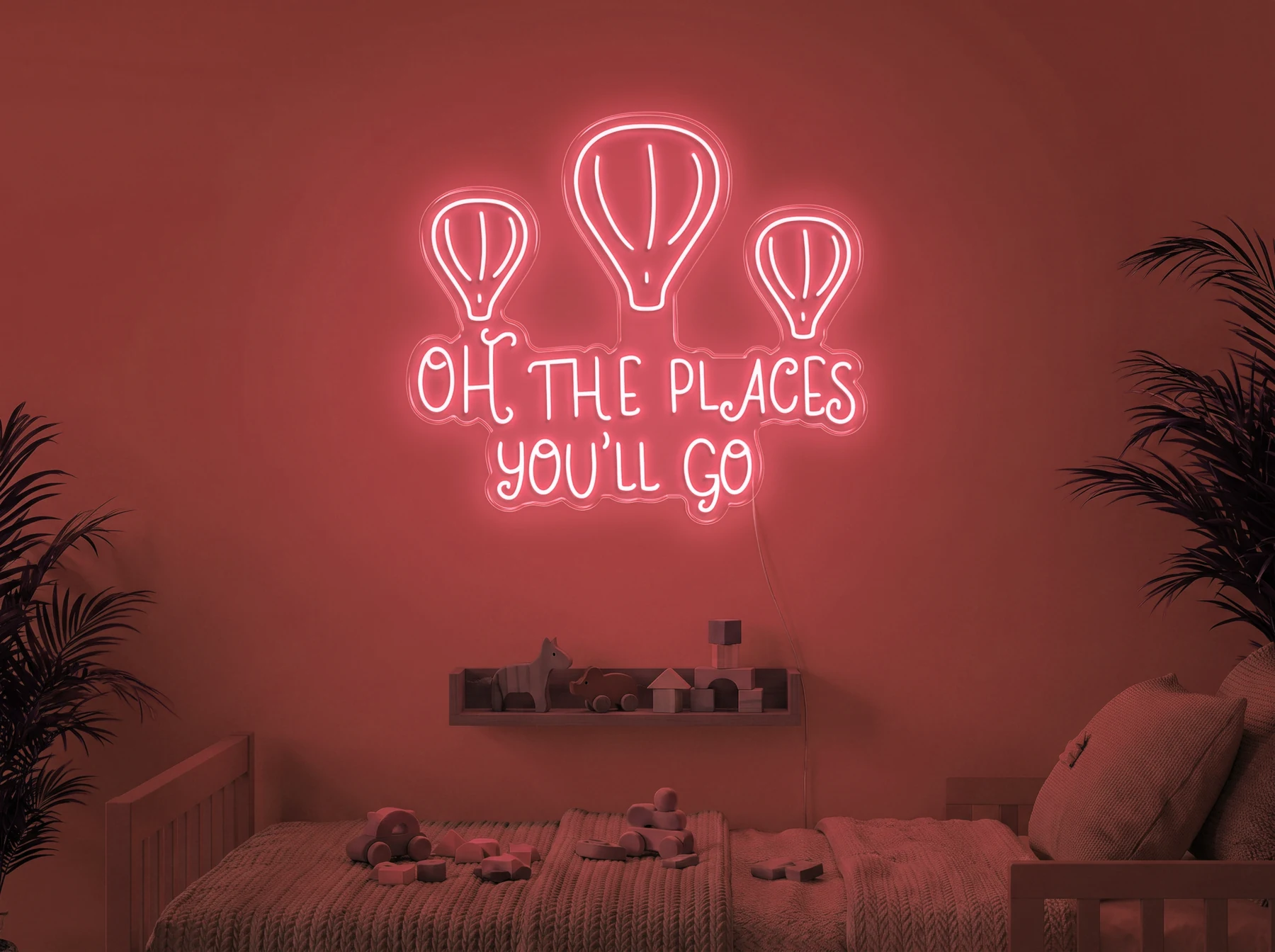 Neonskylt «Oh The Places You’ll Go» i röd LED-neon, monterad på vägg