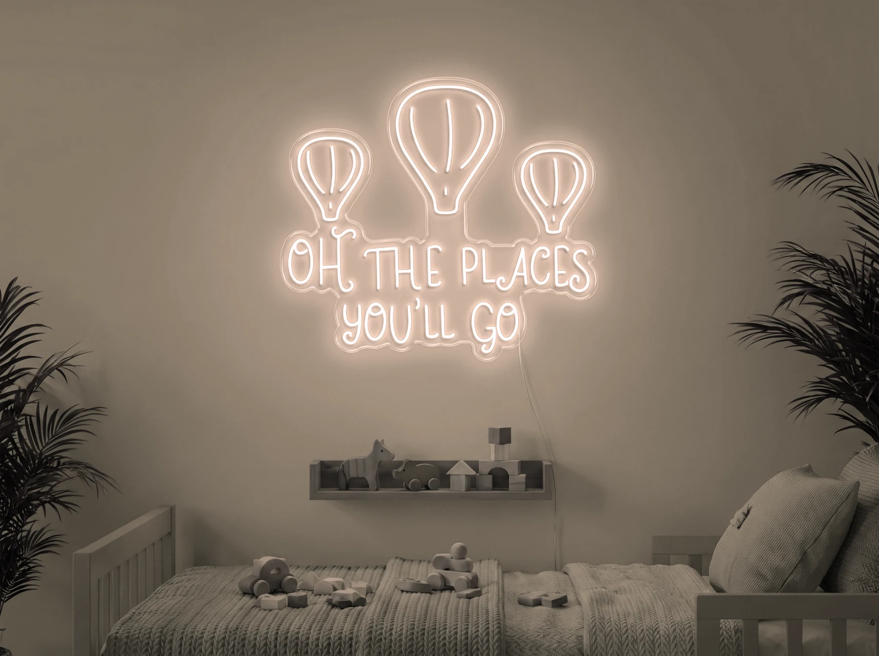 Neonskylt «Oh The Places You’ll Go» i varmvit LED-neon, monterad på vägg