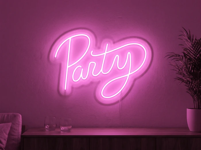 Neonskylt «Party» i rosa LED-neon, monterad på vägg