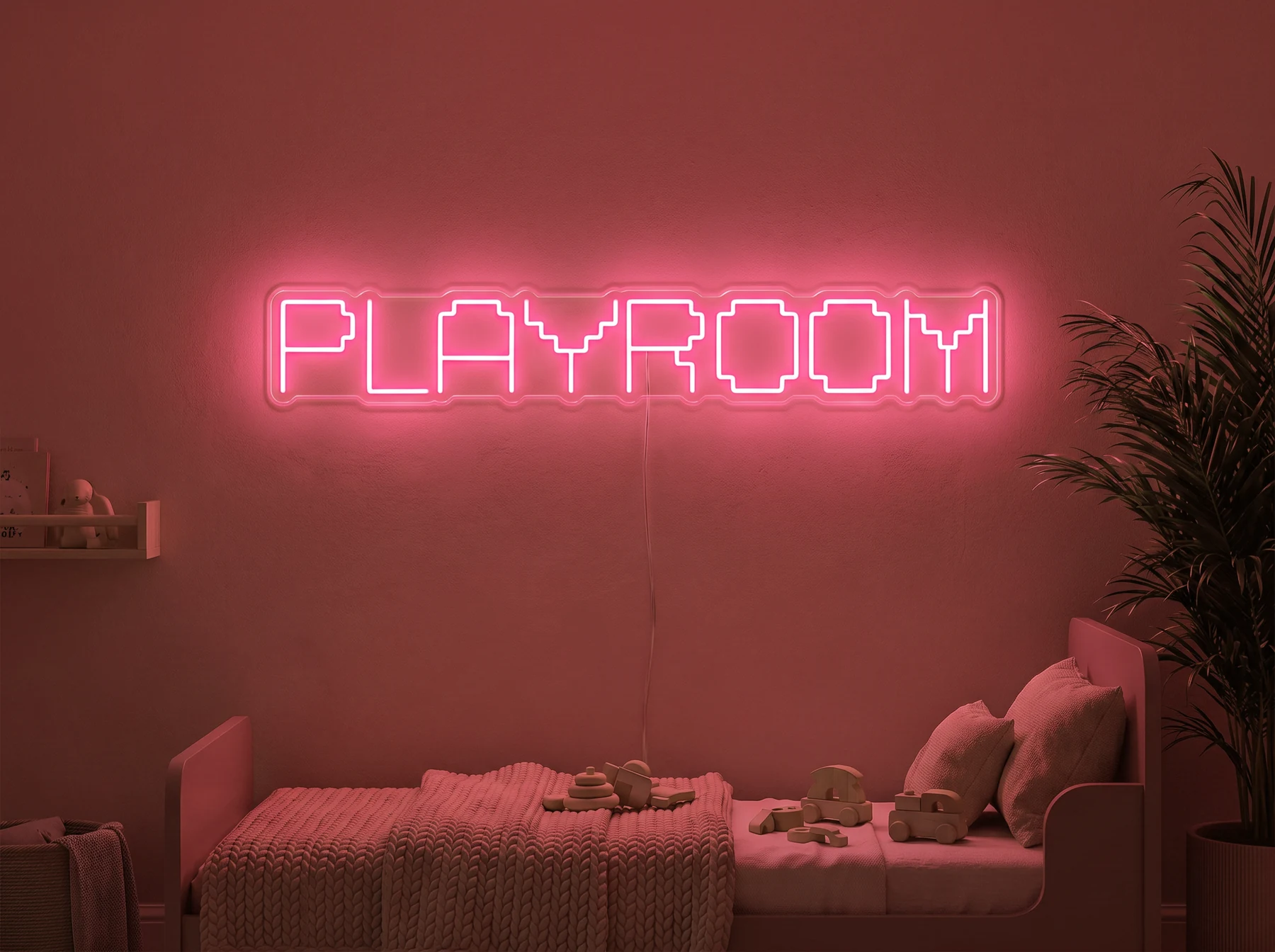 Neonskylt «Playroom» i röd LED-neon, monterad på vägg