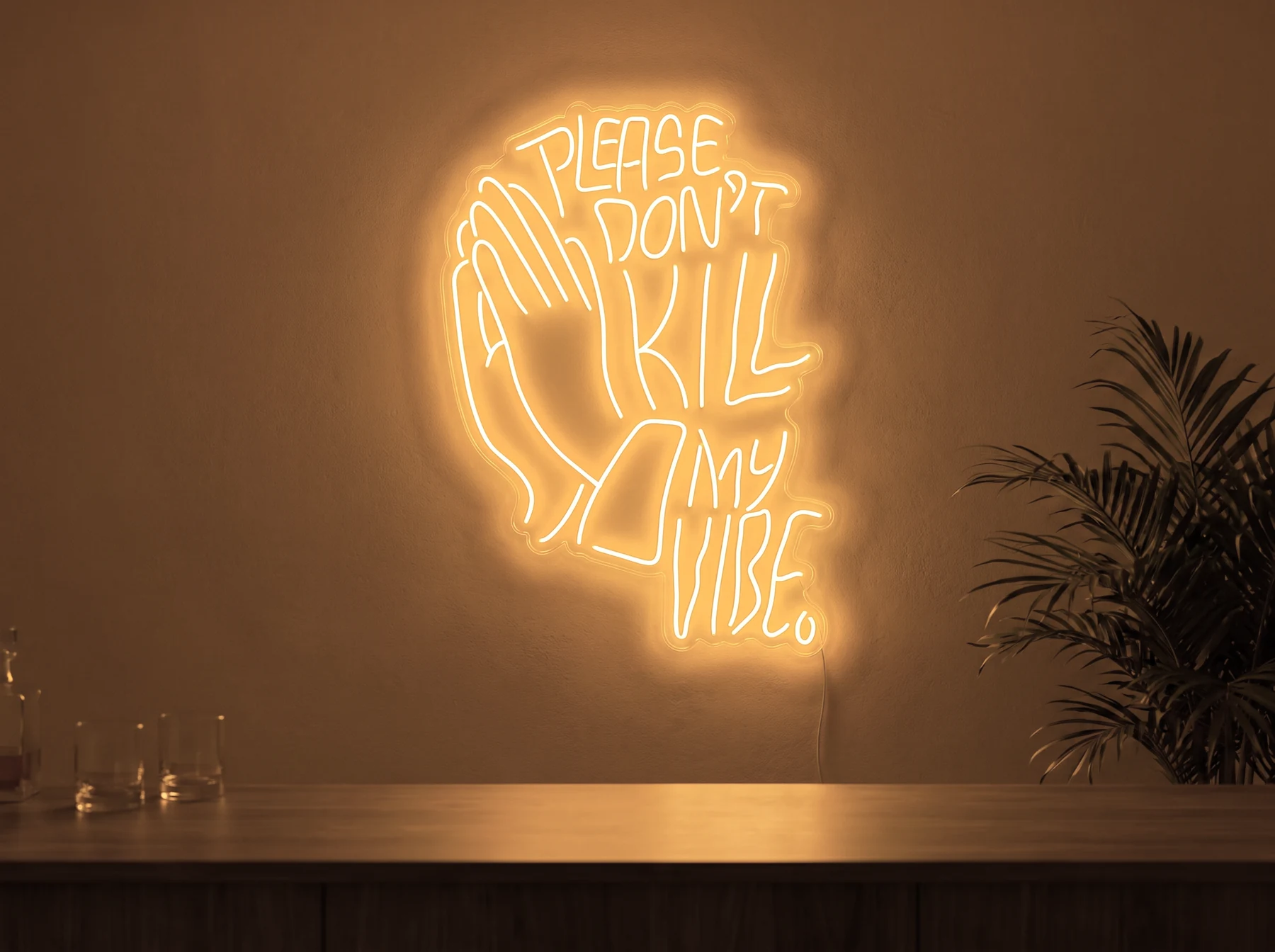 Neonskylt «Please Don’t Kill My Vibe» i orange LED-neon, monterad på vägg