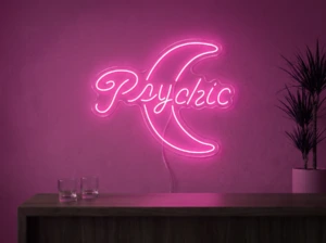 Neonskylt «Psychic» i rosa LED-neon, monterad på vägg