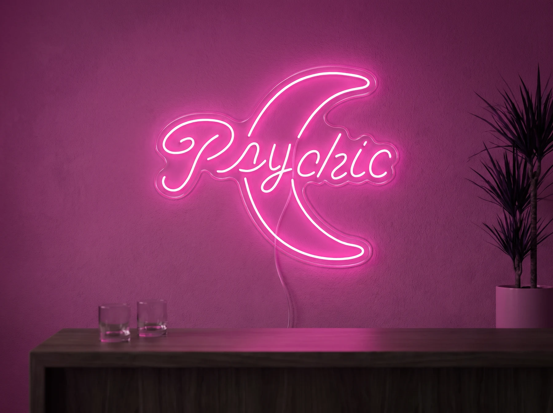 Neonskylt «Psychic» i rosa LED-neon, monterad på vägg