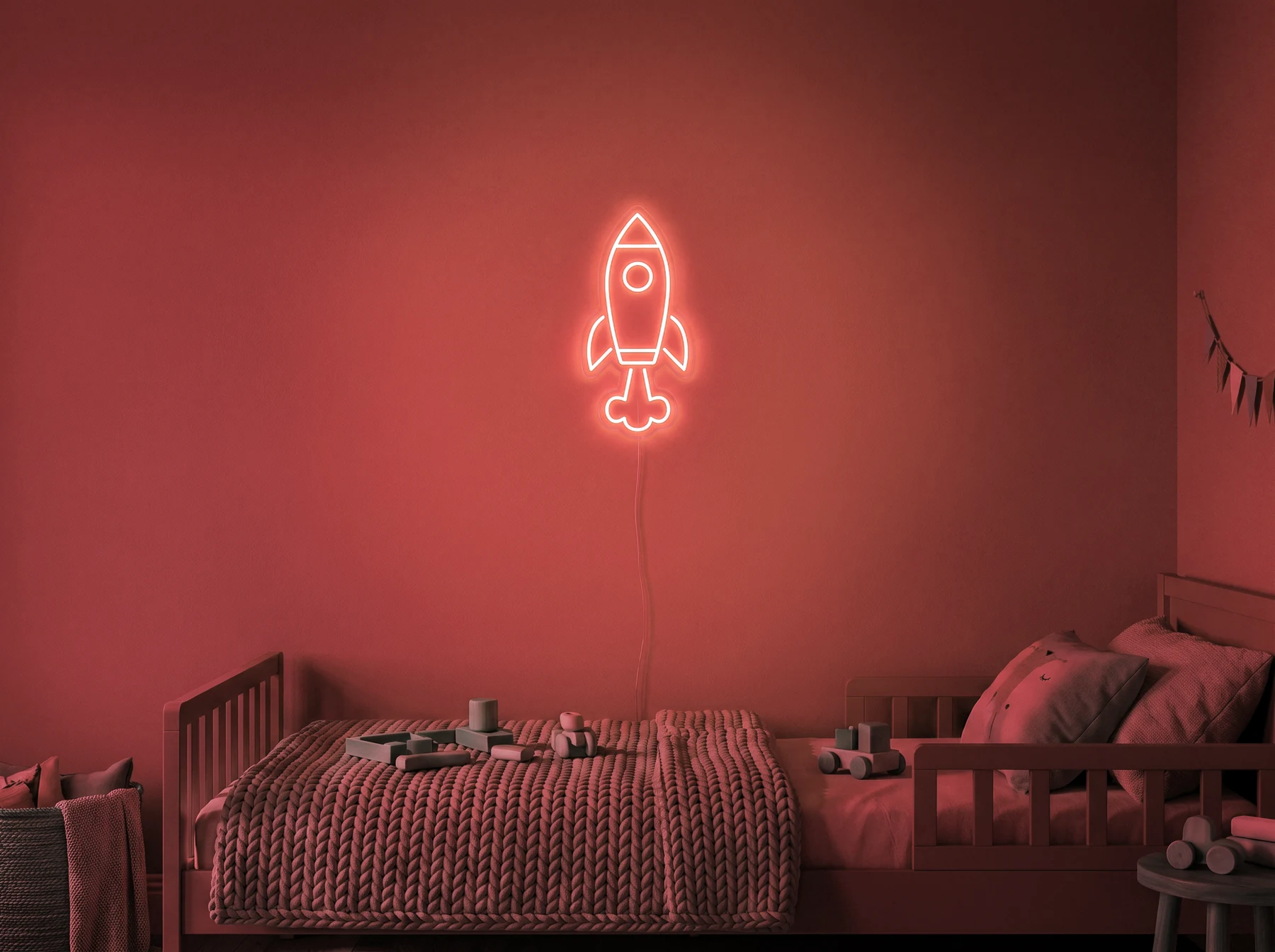 Neonskylt «Raket» i röd LED-neon, monterad på vägg