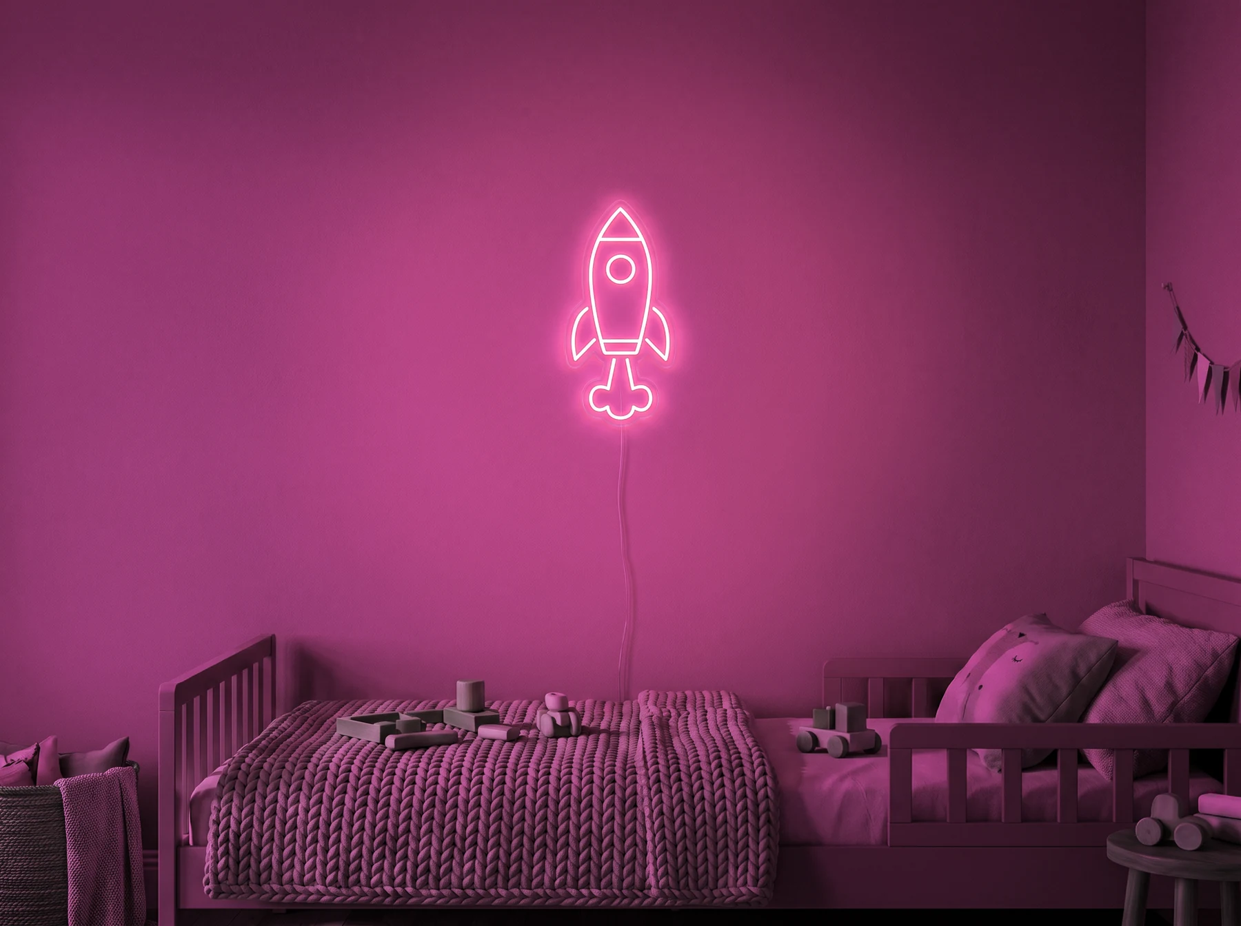 Neonskylt «Raket» i rosa LED-neon, monterad på vägg