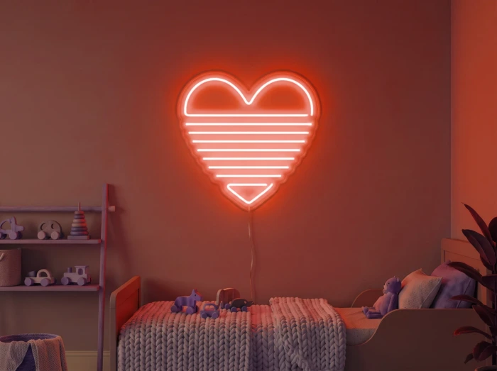 Neonskylt «Regnbågshjärta» i röd LED-neon, monterad på vägg