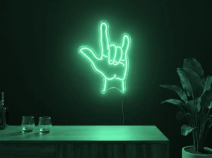 Neonskylt «Rock-hand» i mintgrön LED-neon, monterad på vägg