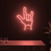 Neonskylt «Rock-hand» i röd LED-neon, monterad på vägg