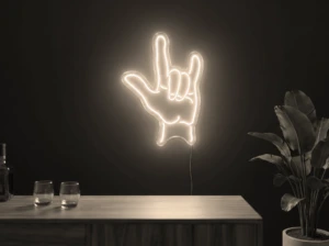 Neonskylt «Rock-hand» i varmvit LED-neon, monterad på vägg