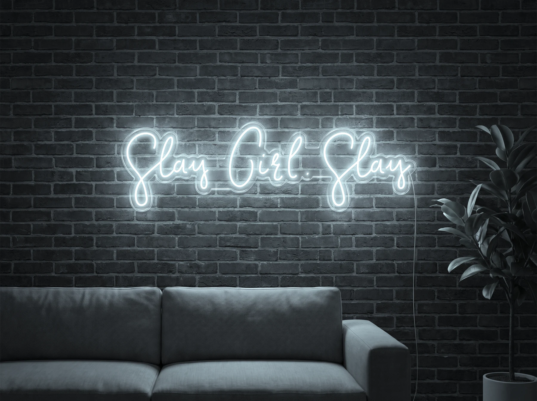 Neonskylt «Slay Girl Slay» i iskall vit LED-neon, monterad på vägg