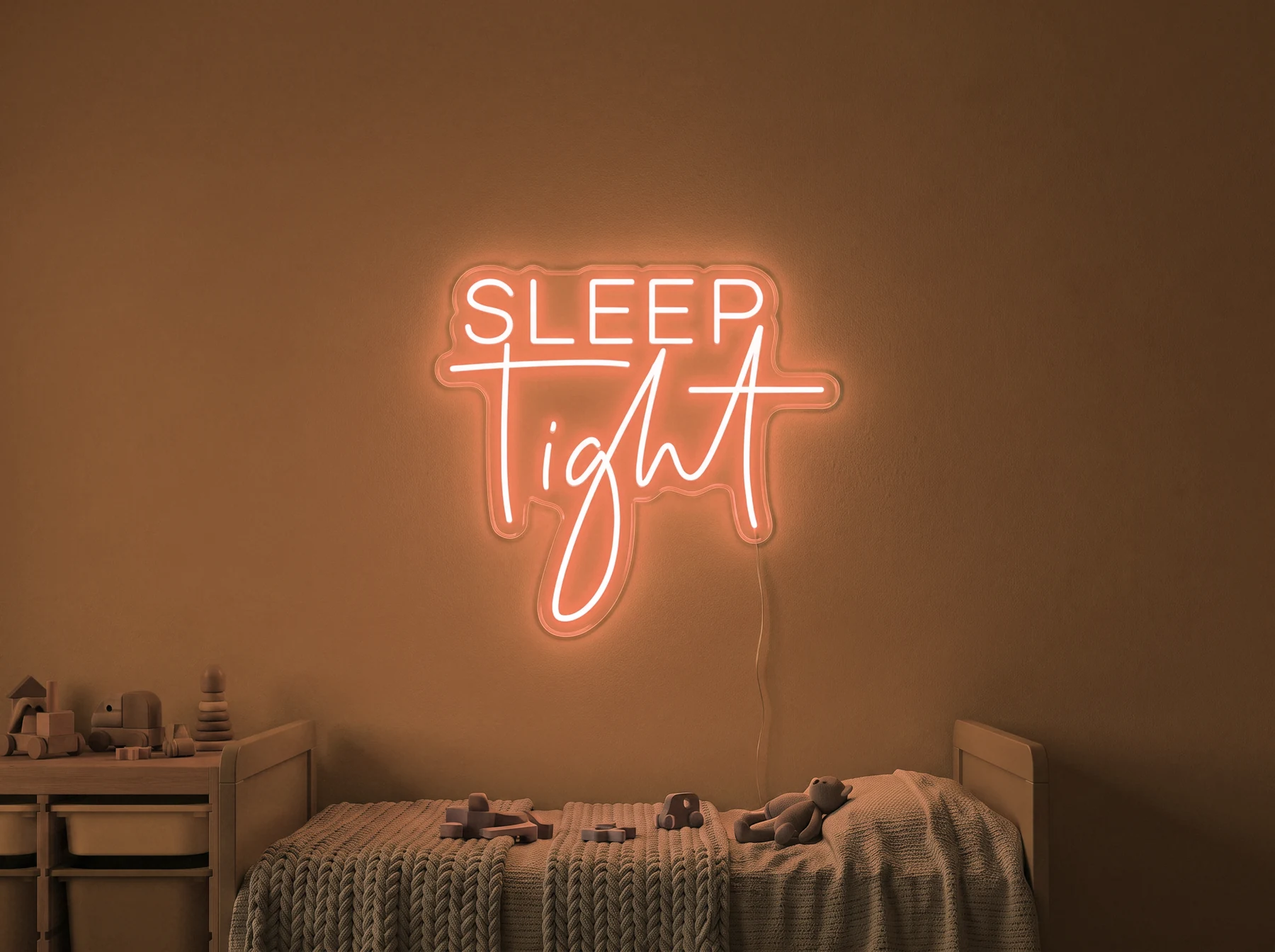 Neonskylt «Sleep Tight» i orange LED-neon, monterad på vägg