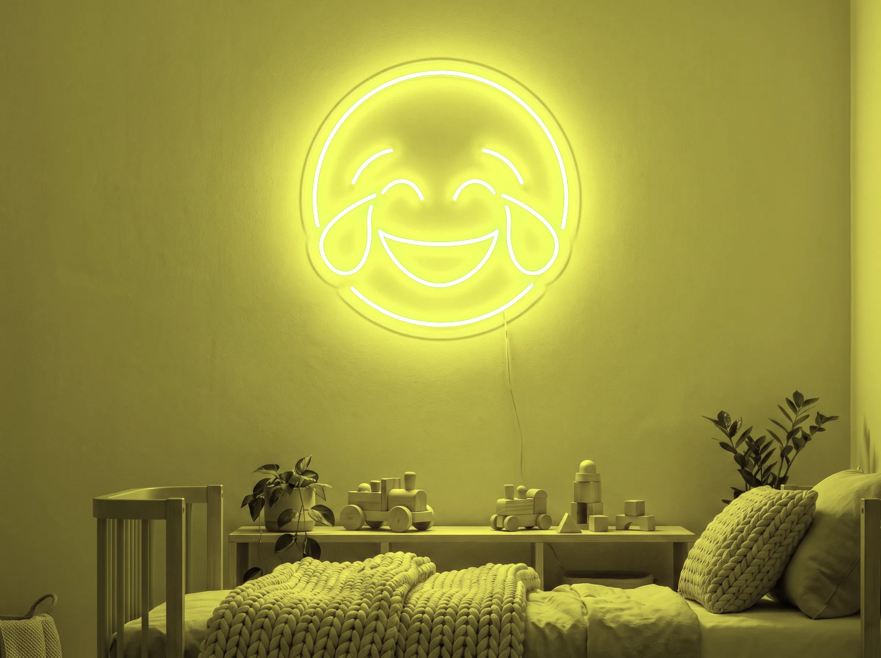 Neonskylt «Smiley» i gul LED-neon, monterad på vägg