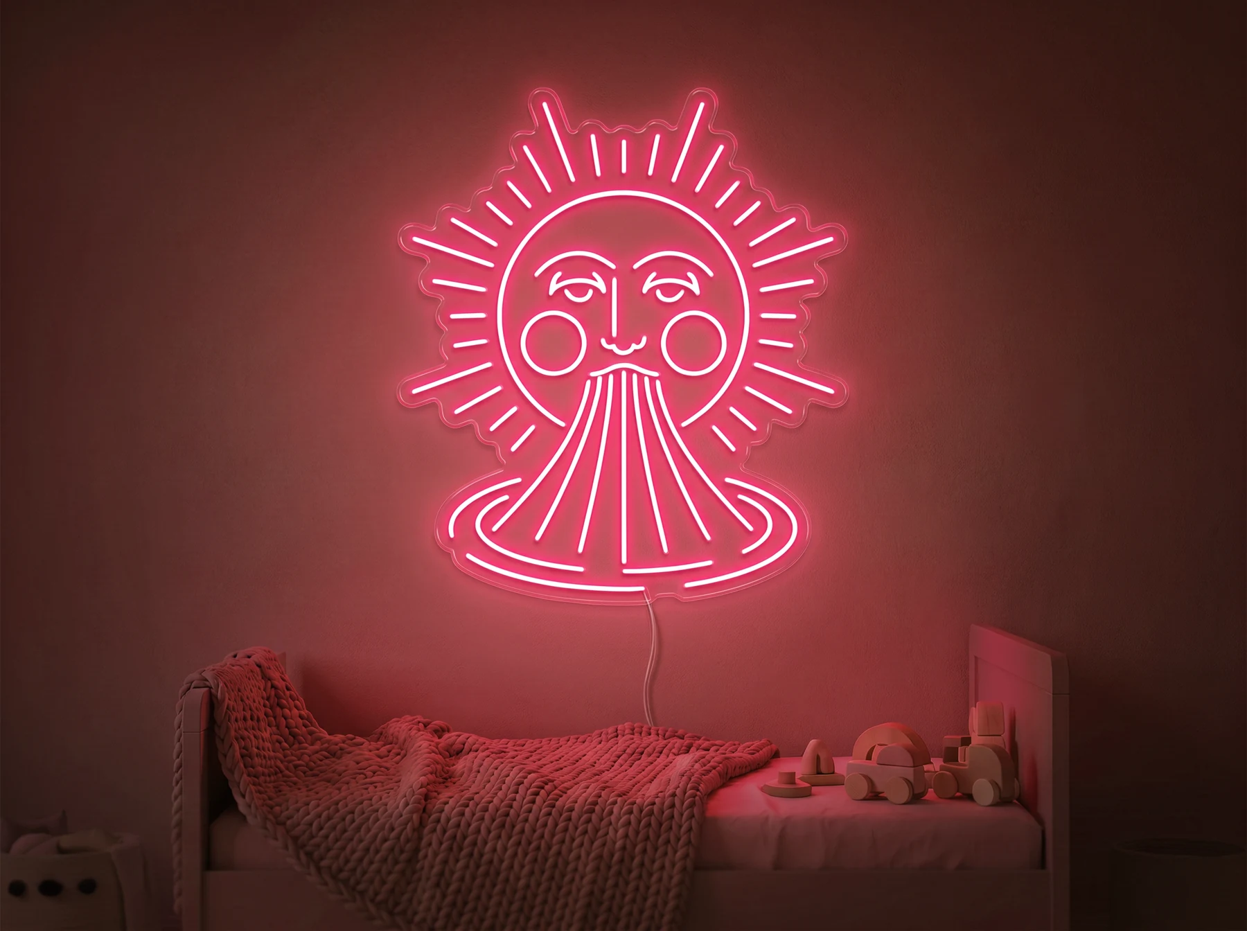 Neonskylt «Sol och regnbåge» i röd LED-neon, monterad på vägg