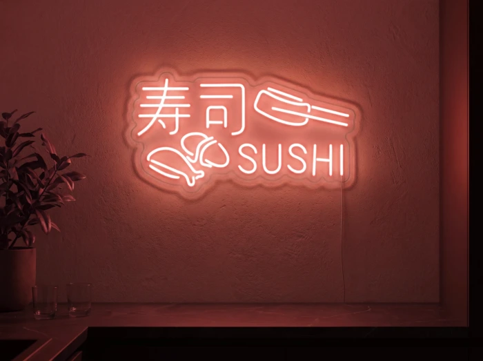 Neonskylt «Sushi» i röd LED-neon, monterad på vägg
