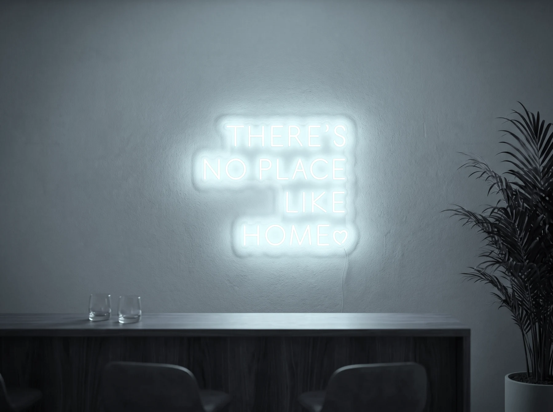 Neonskylt «There’s No Place Like Home, versaler» i iskall vit LED-neon, monterad på vägg