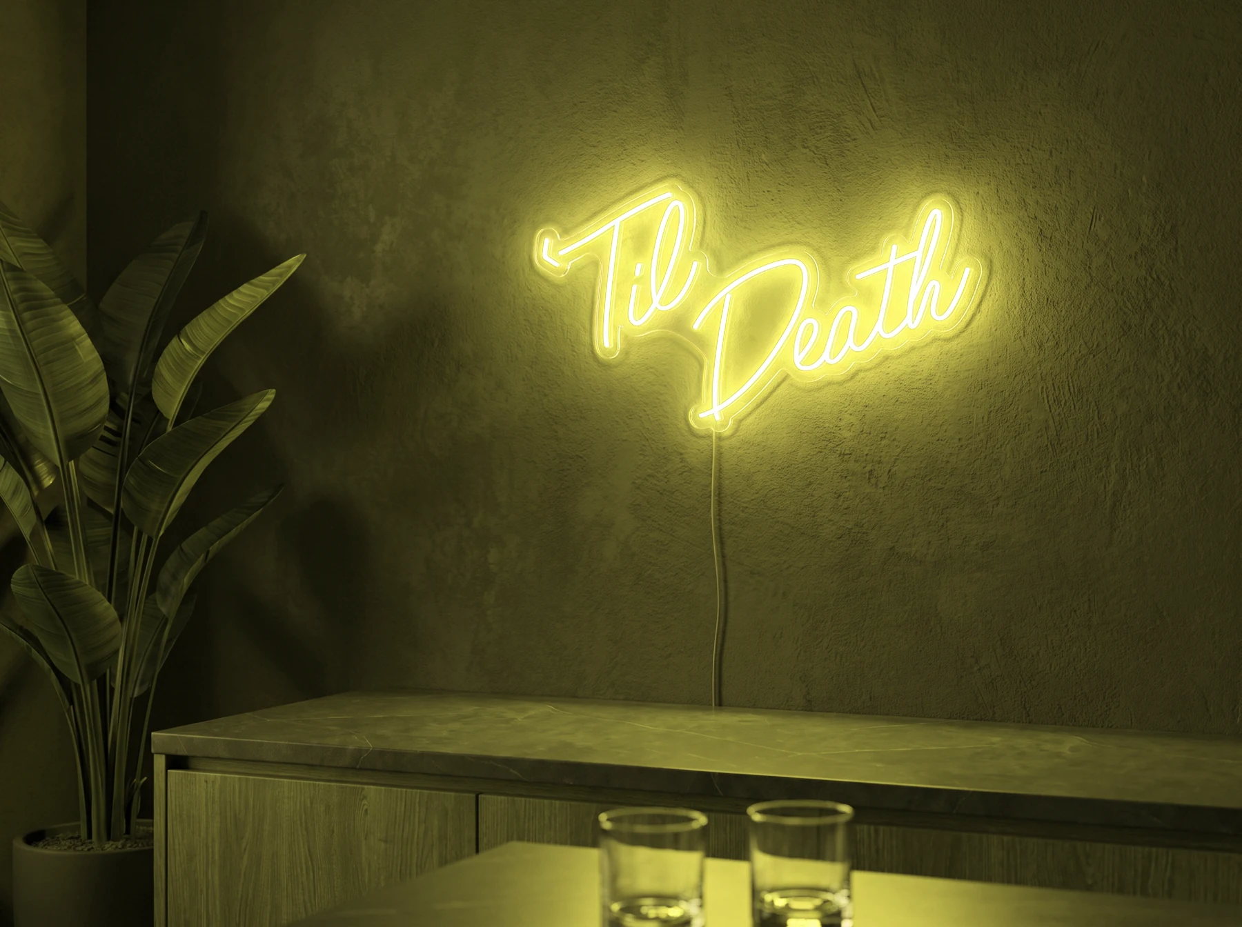 Neonskylt «Til Death» i gul LED-neon, monterad på vägg