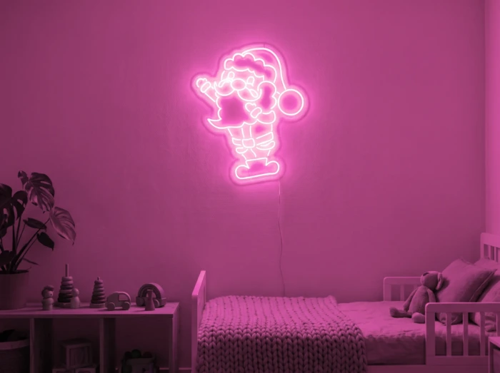 Neonskylt «Tomten» i rosa LED-neon, monterad på vägg