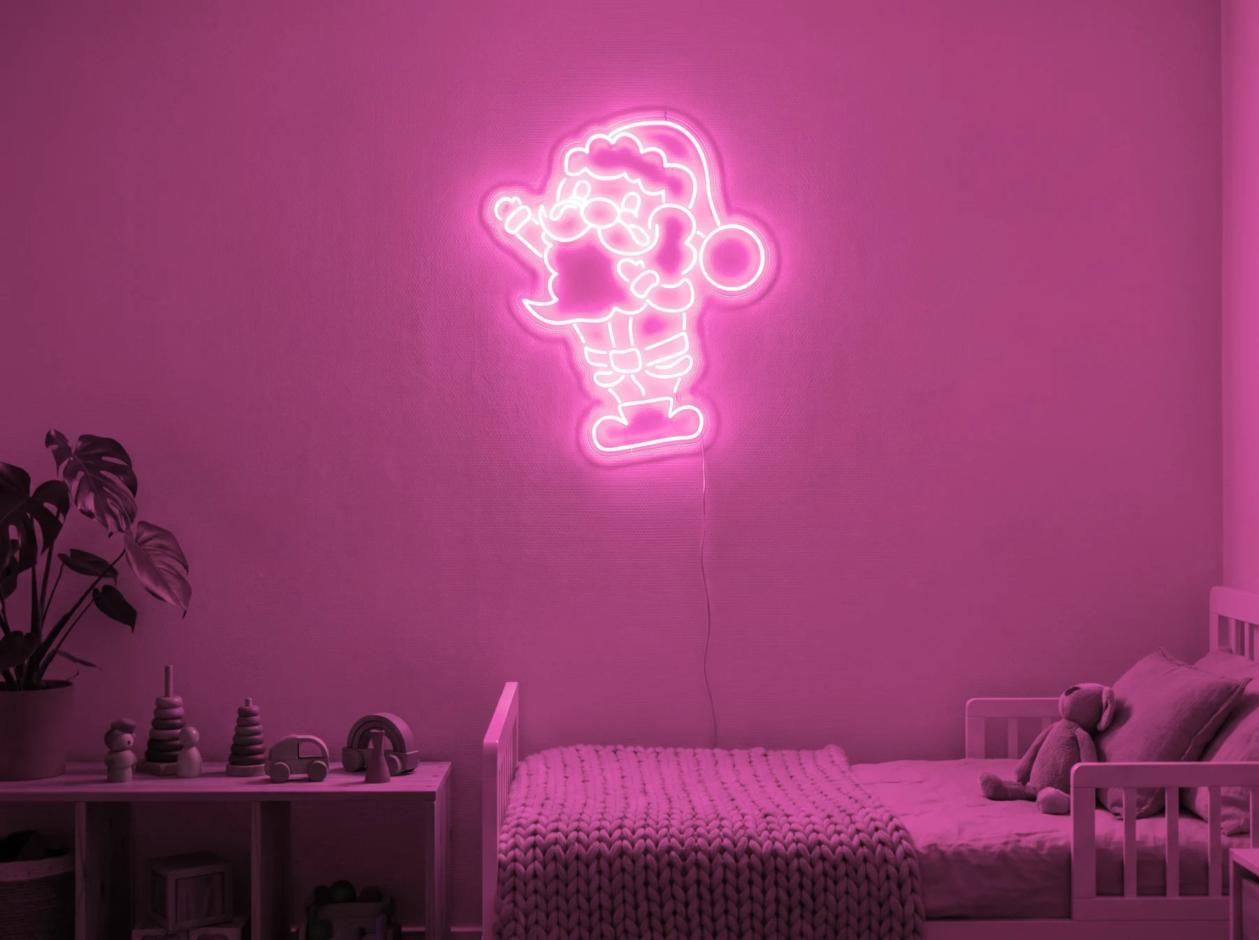 Neonskylt «Tomten» i rosa LED-neon, monterad på vägg