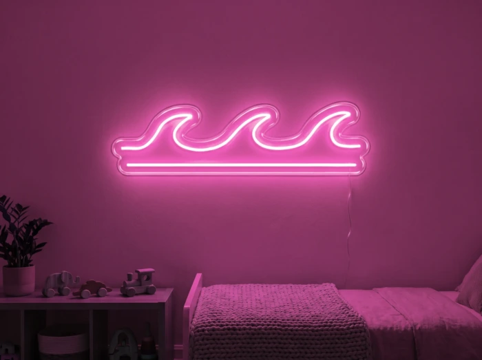 Neonskylt «Våg» i rosa LED-neon, monterad på vägg